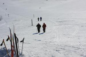 a group of people skiing down a snow covered slope at Kyrön Loma in Kyrö