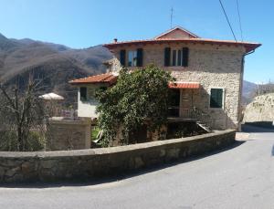 a house on the side of a road at A Cà Du Barbijun in Pieve di Teco