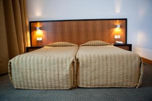 Postel nebo postele na pokoji v ubytování Hotel Bagoeira