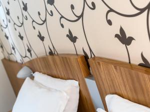 Posteľ alebo postele v izbe v ubytovaní ACasaMia WelcHome Hotel