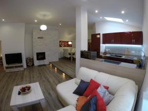TV a/nebo společenská místnost v ubytování Apartmány Cechovní