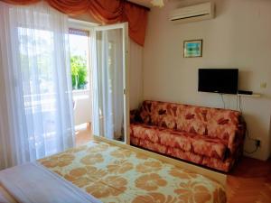 TV a/nebo společenská místnost v ubytování Guest House Mireja