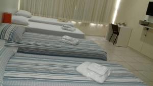 Postel nebo postele na pokoji v ubytování Blu Apart Hotel