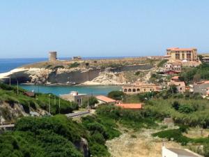 a small town on a hill next to the ocean at la Piazzetta in Santa Caterina