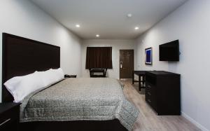 Tempat tidur dalam kamar di Palace Inn-529