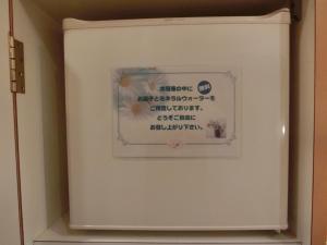 a sign in a white box with writing on it at Hotel Hyper Noah (Adult Only) in Sakai