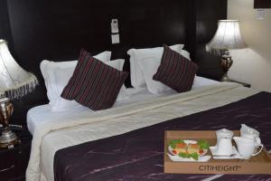Uma cama ou camas num quarto em Citiheight Hotel