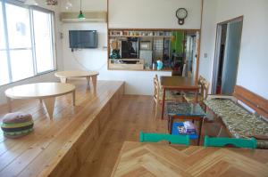 a living room with a couch and a table at Minshuku Namisou in Iriomote