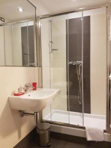 a bathroom with a sink and a shower at B&B Monté in Montesilvano