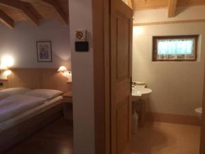 Postel nebo postele na pokoji v ubytování Ciasa Fedo + 11 fotografií