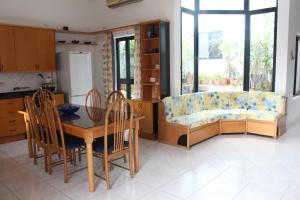 a living room with a couch and a table at The roof garden in Marsaskala