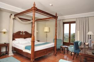 En eller flere senge i et værelse på Parador de Alcañiz