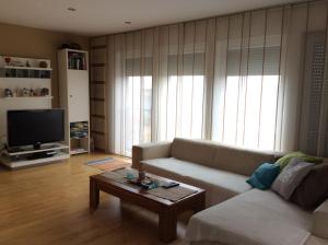 a living room with a couch and a coffee table at Lakeside Villa in Frauenkirchen