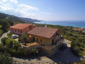 an aerial view of a house with the ocean at Baciati dal Sole in Zambrone