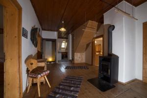 a living room with a wood stove in it at Die Traunmühle in Bad Aussee