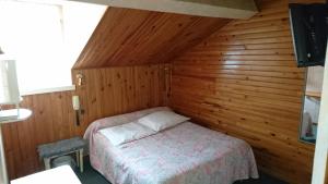 Кровать или кровати в номере Chalet Saint Louis