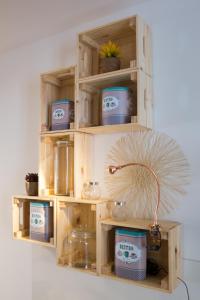 a wooden shelf with a lamp in a room at Ocean Center Apartments in Cascais