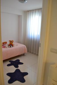 Łóżko lub łóżka w pokoju w obiekcie La Casa Di Melory