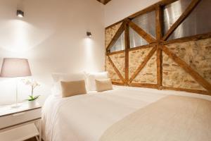 En eller flere senge i et værelse på Bairro Alto Lusitania Dream