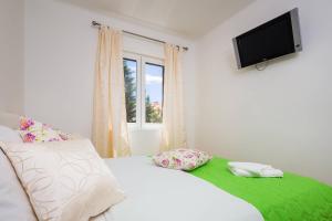 Postel nebo postele na pokoji v ubytování APARTMENT "Patricia"
