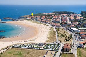 an aerial view of a beach with a resort at Noja Playamar Apartment in Noja