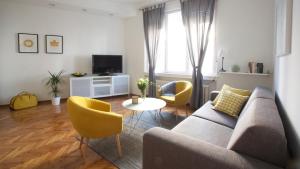 a living room with a couch and two chairs at Premium Class Apartments II in Zagreb