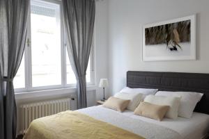 a bedroom with a large bed and a window at Premium Class Apartments II in Zagreb