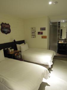 Postel nebo postele na pokoji v ubytování Re-Change Hotel Taipei
