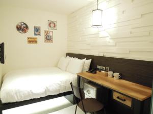 Postel nebo postele na pokoji v ubytování Re-Change Hotel Taipei
