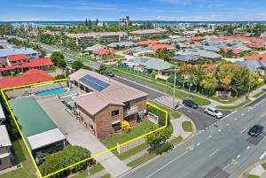 an overhead view of a town with a street at Golden Beach Motor Inn, Caloundra in Caloundra