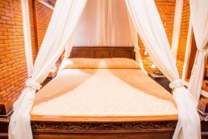Postel nebo postele na pokoji v ubytování Ari La Homestay