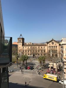 a large building with a yellow bus in front of it at Chic & Basic Lemon Boutique Hotel in Barcelona +23 photos