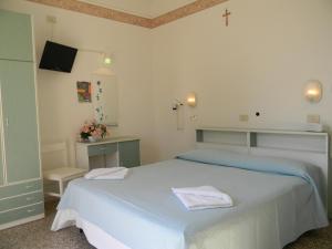 Кровать или кровати в номере Hotel Urania