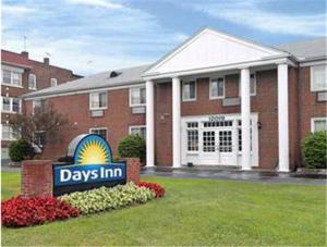 a building with a days inn sign in front of it at Days Inn by Wyndham Cleveland Lakewood in Lakewood