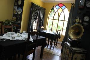 a dining room with a table and a window at Danlee Overnight Accommodation in Polokwane