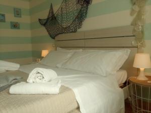Postel nebo postele na pokoji v ubytování Relais Villa Lézard