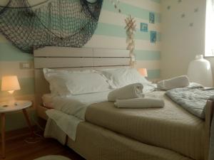 Postel nebo postele na pokoji v ubytování Relais Villa Lézard