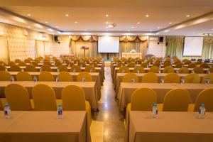 a room full of tables and chairs with water bottles on them at Sri Siam Resort in Kanchanaburi City