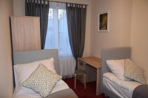Posteľ alebo postele v izbe v ubytovaní Botanik Hostel
