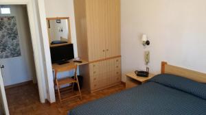 Postel nebo postele na pokoji v ubytování Albergo Le Rose
