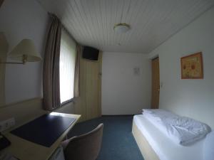 Postel nebo postele na pokoji v ubytování Hotel Wasserfall