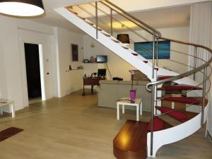 a living room with a staircase in a house at Villa Celeste B&B in Pontecagnano