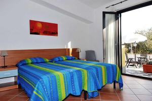 Letto o letti in una camera di Verdeblu Country Hotel
