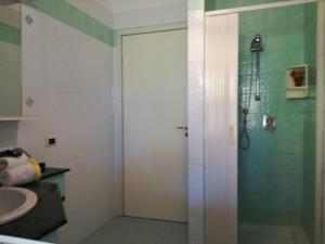 a bathroom with a shower with a glass door at Profumo di Mare Fronte Spiaggia in Noto Marina +41 photos