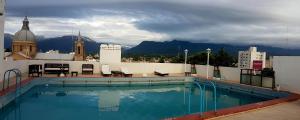 a large swimming pool on the roof of a building at Plaza Hotel in La Rioja