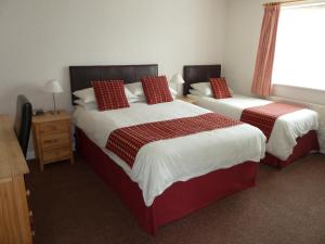 Tempat tidur dalam kamar di The Winsford Lodge