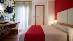 Posteľ alebo postele v izbe v ubytovaní ACasaMia WelcHome Hotel