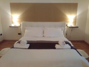 Postel nebo postele na pokoji v ubytování Relais Villa Lézard