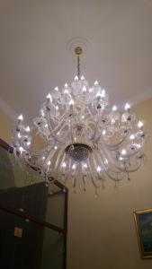 a chandelier hanging from a ceiling in a room at B&B Al Piazza Marina in Palermo