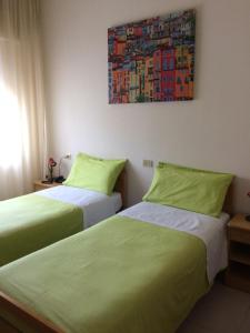 Posteľ alebo postele v izbe v ubytovaní Albergo Stella